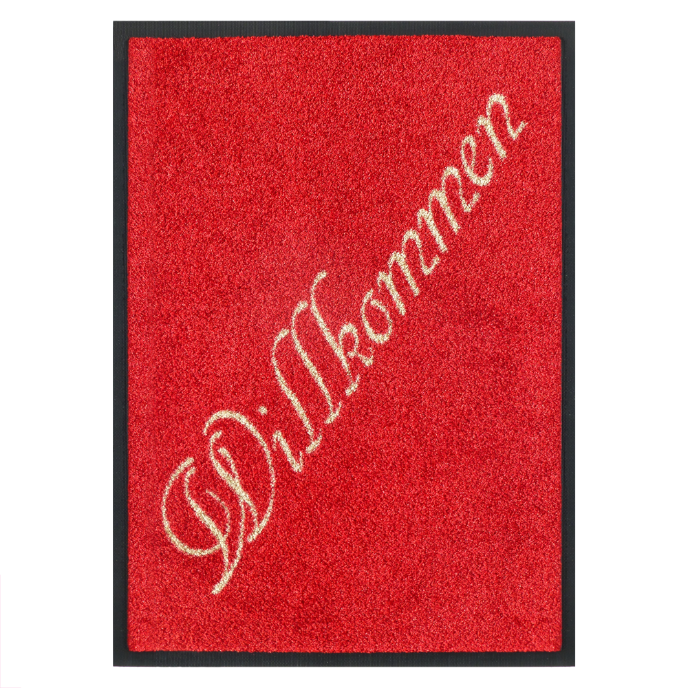 rote Fußmatte mit einem Schriftzug "Willkommen" rote Fußmatte mit einem Schriftzug "Willkommen"